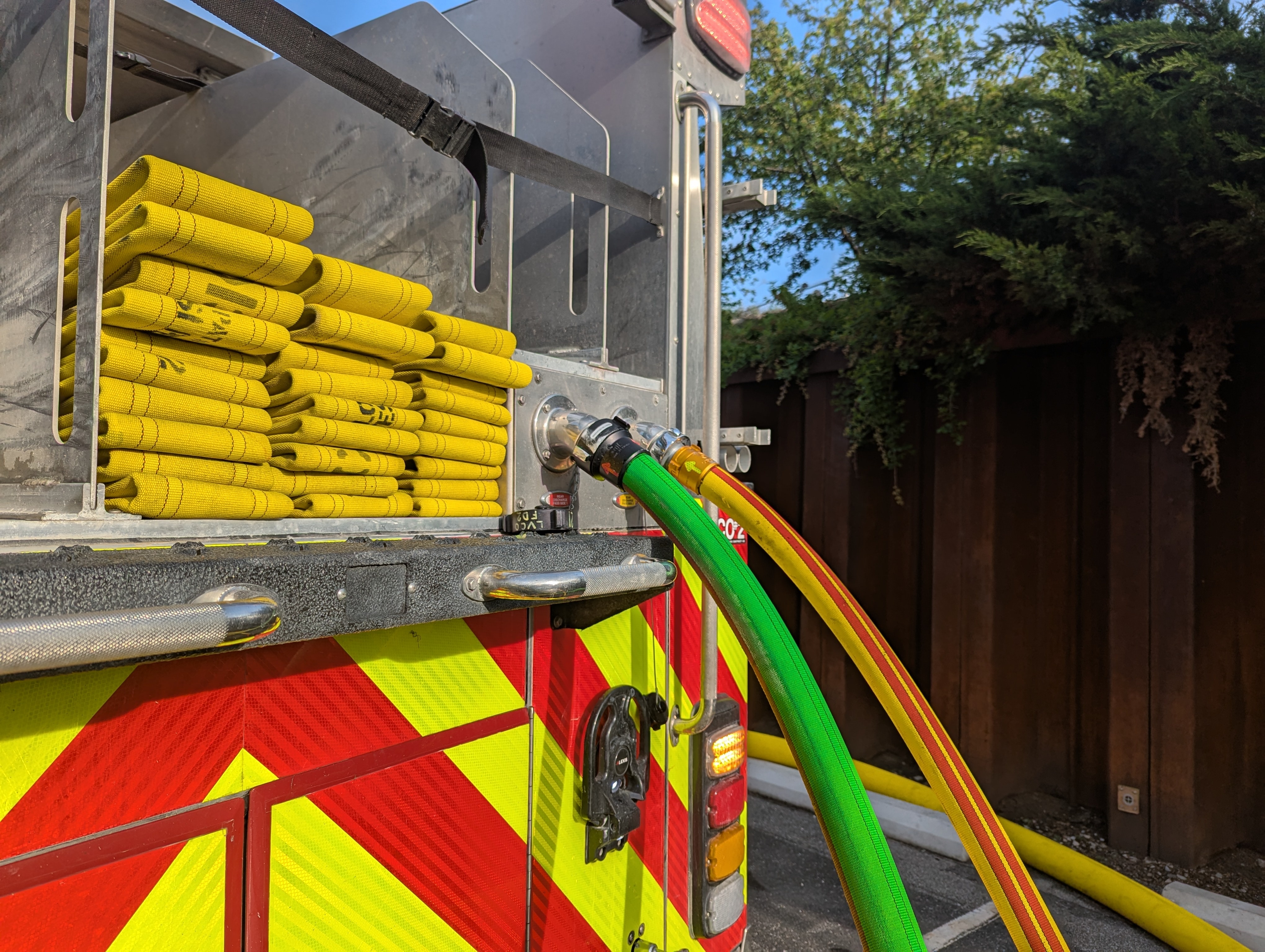 Yellow fire hose in a fire engine bed